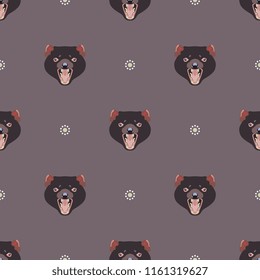 Seamless geometrical pattern with faces of Tasmanian devil and abstract floral polka dots.