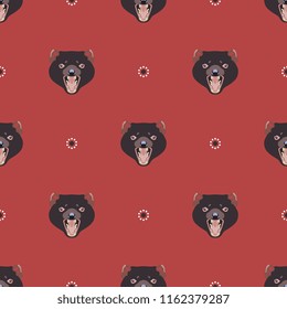 Seamless geometrical pattern with faces of Tasmanian devil and abstract floral polka dots.