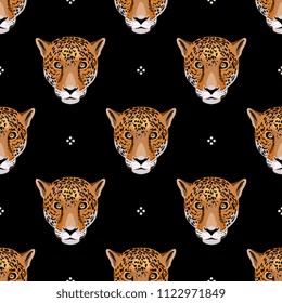 Seamless geometrical pattern with leopard or jaguar faces and polka dots.