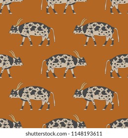 Seamless geometrical pattern with silhouettes of ancient Egyptian cows. Cartoon style.