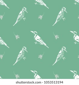Seamless geometrical pattern with silhouettes of woodpecker and tree leaves. Based on hand drawn sketch.
