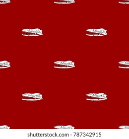 Seamless geometrical pattern with snake skulls on red background.