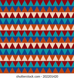 Seamless geometrical pattern with triangle element in several colors: red, brown, blue, orange