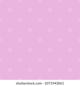 Seamless geometrical polka dot pattern with small  simple dotted circles.