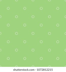 Seamless geometrical polka dot pattern with small simple dotted circles.