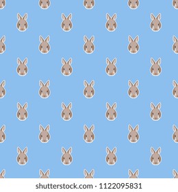Seamless geometrical polka dot pattern with simple bunny faces.