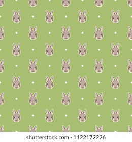 Seamless geometrical polka dot pattern with simple bunny faces and polka dots. Cartoon childish style. Cute Easter motif.