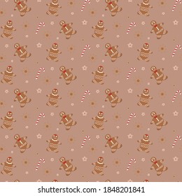 seamless gingerbread christmas pattern of gingerbread men and striped candy canes and stars