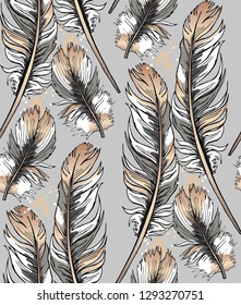 Seamless gold and silver pattern. Bird feathers on a gray background. Textile composition, hand drawn style print. Vector illustration.