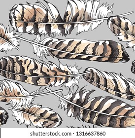 Seamless gold and silver pattern. Owl bird feathers on a gray background. Textile composition, hand drawn style print. Vector illustration.