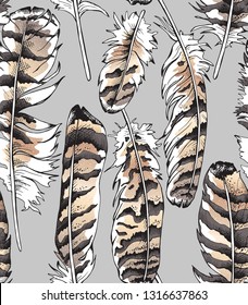 Seamless gold and silver pattern. Owl bird feathers on a gray background. Textile composition, hand drawn style print. Vector illustration.