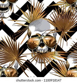 Seamless gold and silver pattern. Tropical leaves. Exotic fan palm and human skulls in a sunglasses on a geometric background. Vector illustration.