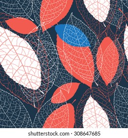 Seamless graphic pattern of autumn leaves on a dark background