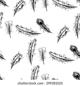 Seamless graphic pattern of feathers . Ink elements.