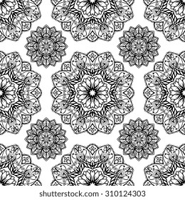 Seamless graphic pattern of mandalas on a white background. Vector floral ornament. Template for textile.