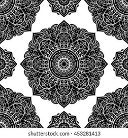 Seamless, graphic pattern of mandalas on a white background. Vector elegance ornament. Black stencil for any surface. 