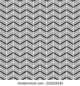 Seamless gray interchanging chevrons pattern vector