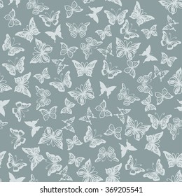 Seamless gray pattern with silhouettes of butterflies