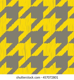 Seamless gray and yellow detailed ikat houndstooth textile pattern vector