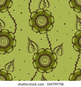 Seamless green background, ethnic floral feminine pattern with flower heads, leaves and dots.