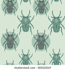 Seamless green beetle pattern with hand drawn doodle bug illustrations. 