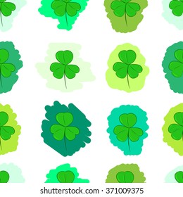 Seamless green painted shamrocks
