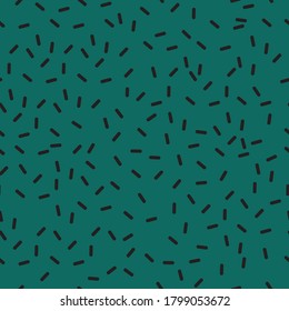 Seamless green sprinkle pattern in 90s memphis style