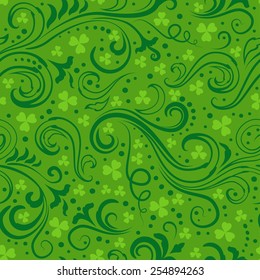 Seamless green St. Patrick's day background with floral swirls and clover leaves.