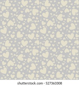 Seamless grey background with  beige hearts.