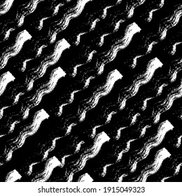 seamless grunge pattern in black and white. the wavy prints of the dry brush with different intensity are directed diagonally and form an abstract background. stock vector illustration. EPS 10.