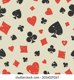 Seamless grunge pattern with card suits - hearts, clubs, spades and diamonds. Scratched Casino gambling, poker background. Alice in wonderland ornament.