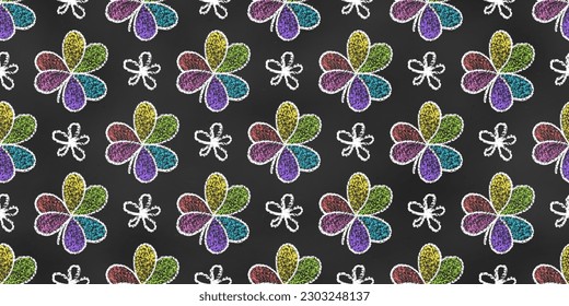 Seamless Grunge Pattern of Chalk Drawn Sketches Rainbow Leaves of Clover on Dark Blackboard. Continuous Symmetric Background of Childish Realistic Crayon-Drawn Symbols on Chalkboard Backdrop.