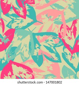 Seamless grunge pattern with colorful leaves on pale green background