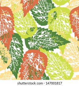 Seamless grunge pattern with colorful leaves on white background