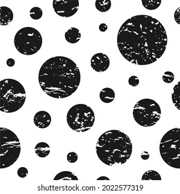 Seamless grunge pattern of little black dots or spots on white. Scratched vintage ornament. Decorative wallpaper, good for printing. Vector illustration. Black and white.
