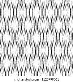 Seamless halftone vector background.Hexagons filled with black circles .