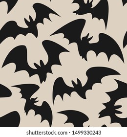 Seamless halloween pattern with bats on gray background for greeting card, gift box, wallpaper, fabric, web design.