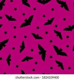 Seamless halloween pattern with bats on a purple background