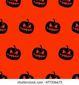 Seamless Halloween pattern with black pumpkin on orange background
