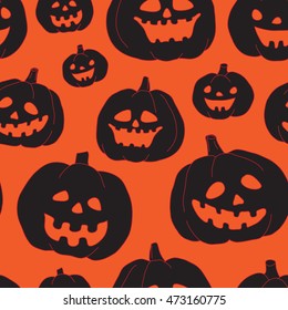 Seamless Halloween pattern with black pumpkins on orange background