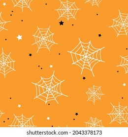 Seamless halloween pattern. cobwebs, stars and dots .on an orange background. vector texture. trend print for textiles and wallpaper, packaging.