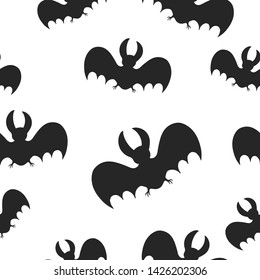 Seamless Halloween pattern with cute bat silhouettes. Horror party background. Paper wrap texture.