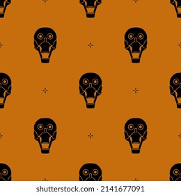 Seamless Halloween pattern with human skulls. Black silhouettes on orange background.