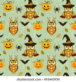 Seamless halloween pattern with pumpkin and owls on  turquoise grunge retro background