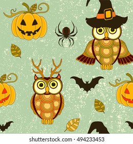 Seamless halloween pattern with pumpkin and owls on turquoise grunge retro background