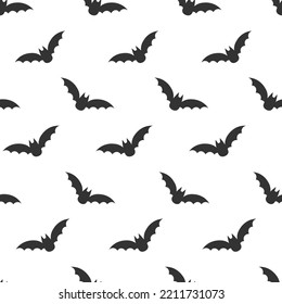 Seamless Halloween pattern: silhouette of bats in the sky. Flat style vector image.