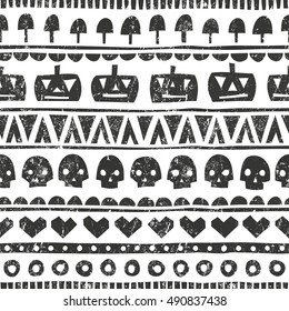Seamless halloween pattern in tribal style. Monochrome background with pumpkins, skulls, mushrooms and hearts. EPS 10 vector illustration.