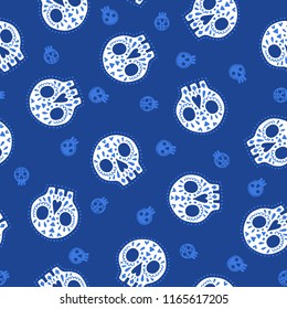 Seamless halloween pattern. Vector background with skulls. Design for prints, shirts and posters.