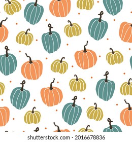 Seamless halloween pattern. white background . wonderful colored pumpkins. orange dots. vector texture. trend print for textiles.