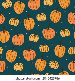 Seamless halloween pattern . wonderful orange pumpkins and dots on a dark blue background. a vector image. fashionable print for textiles, packaging and wallpaper.